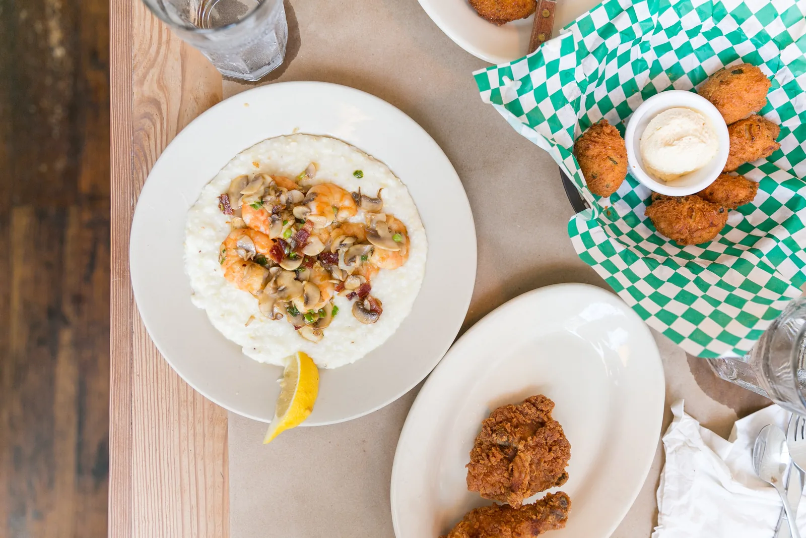 Shrimp and grits with mushrooms, scallions and bacon over cheese grits, photographed at a Charleston restaurant that is not on this list.