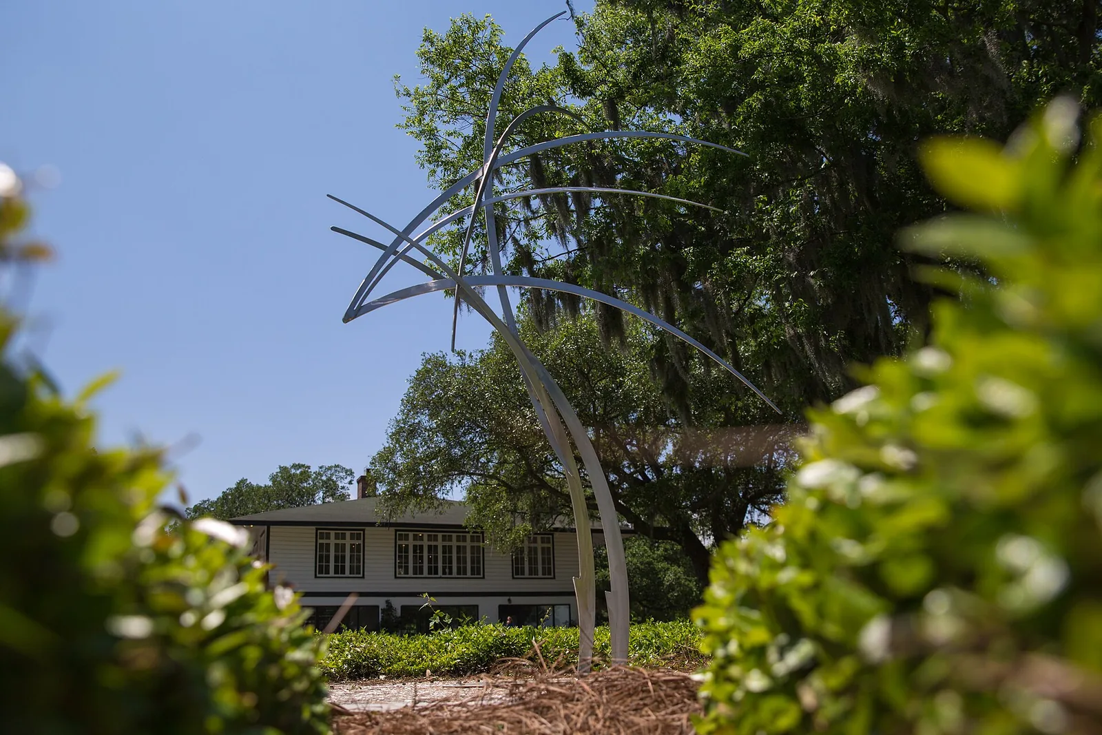 A sculpture from the city's outdoor sculpture exhibition stands on the lawn at Riverfront Park in North Charleston, where Holy Smokes is held.