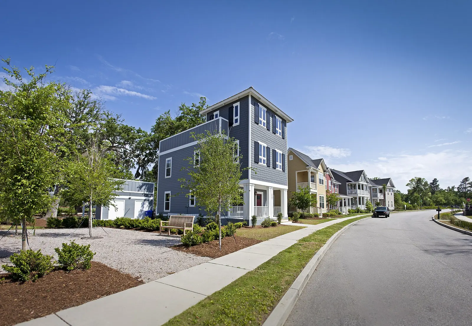Two- and three-story houses line a street in the Oak Terrace Preserve neighborhood of North Charleston.