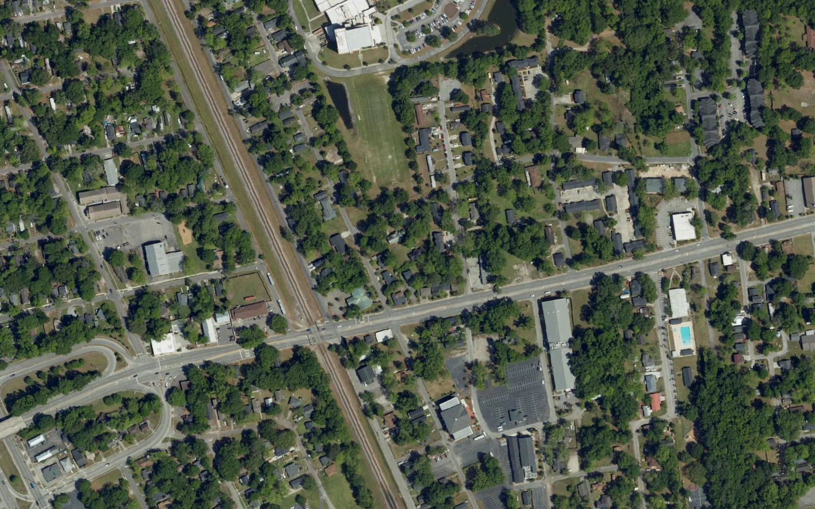 Aerial view of Liberty Hill in North Charleston, with a rail line running diagonally between blocks of houses.