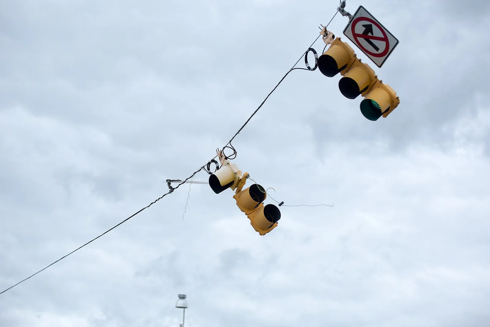 Traffic signals dangle from a damaged line after Hurricane Matthew in North Charleston.