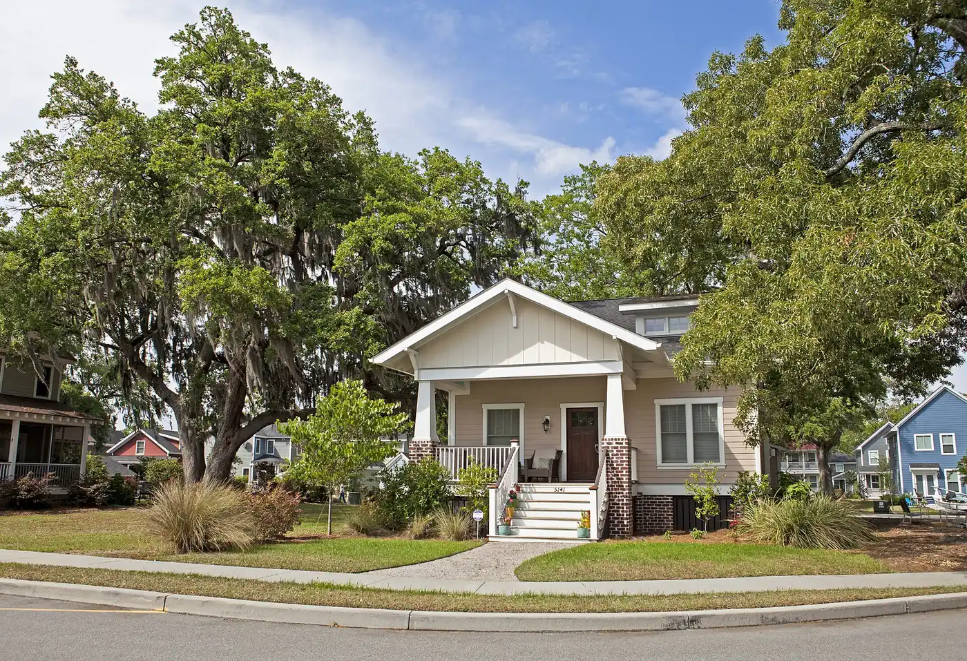 A craftsman-style house on a tree-lined street in the Oak Terrace Preserve neighborhood of North Charleston.