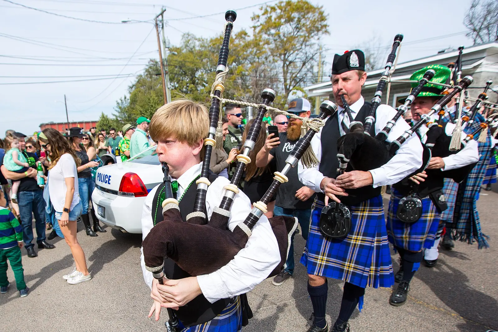 Bagpipers march in kilts in the St. Patrick's Day parade in North Charleston's Park Circle area.