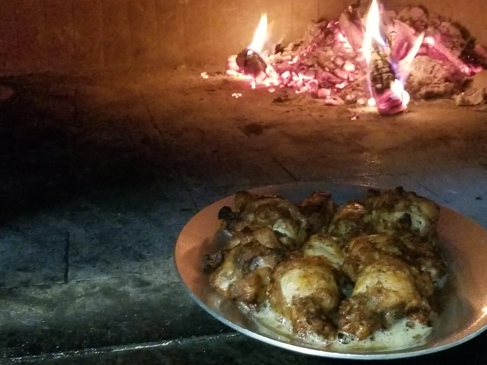 Chicken wings cooked in a wood-burning pizza oven. The photo was taken at a restaurant in Rockville, Md., not in North Charleston.