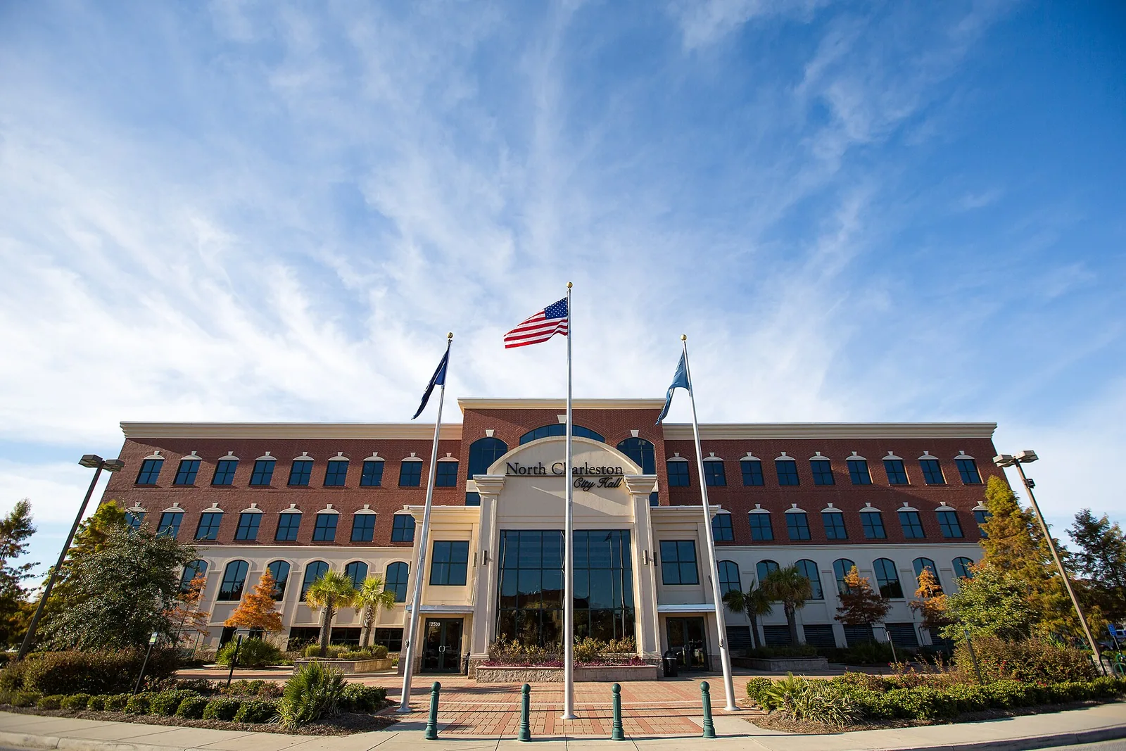 Flags fly in front of North Charleston City Hall on City Hall Lane.